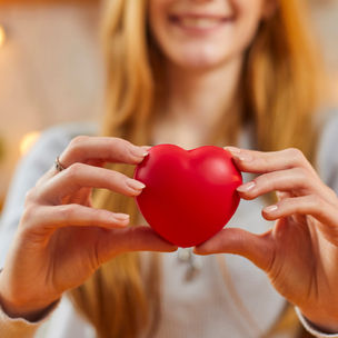 Women holding heart toy in her hands
