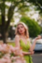 Side-way looking over shoulder with flowers framing | XF90mm F2 WR Fujifilm X-H2 | ISO 125, 1/1000s, F2 | Model: lily.kirova