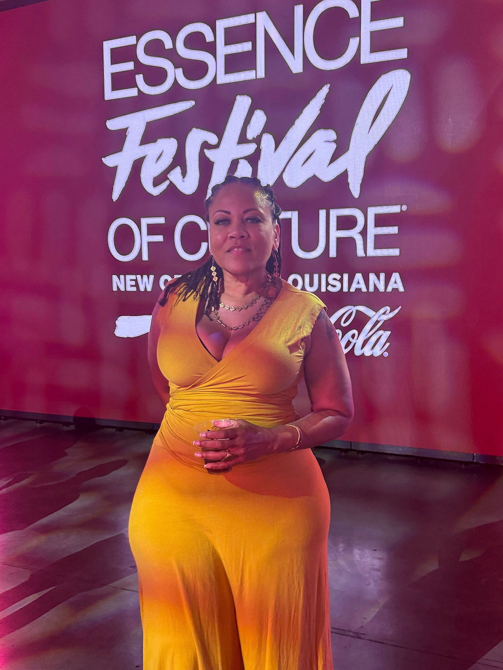 Black Women Vend founder, Jenn Laurent, in front of Essence Culture Fest 2025 signage