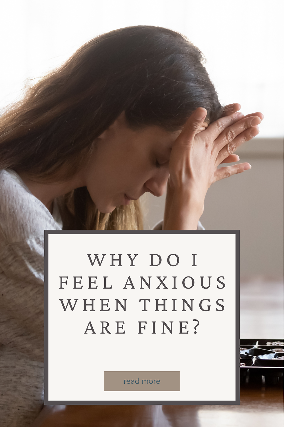 Woman with hands on forehead looking down with anxious expression. Title reads: Why Do I Feel Anxious When Things Are Fine?