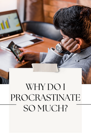 Man in gray suit sits at a desk, using a smartphone and looking at a laptop with bar charts in a warm office setting. with text overlay "why do I procrastinate so much"
