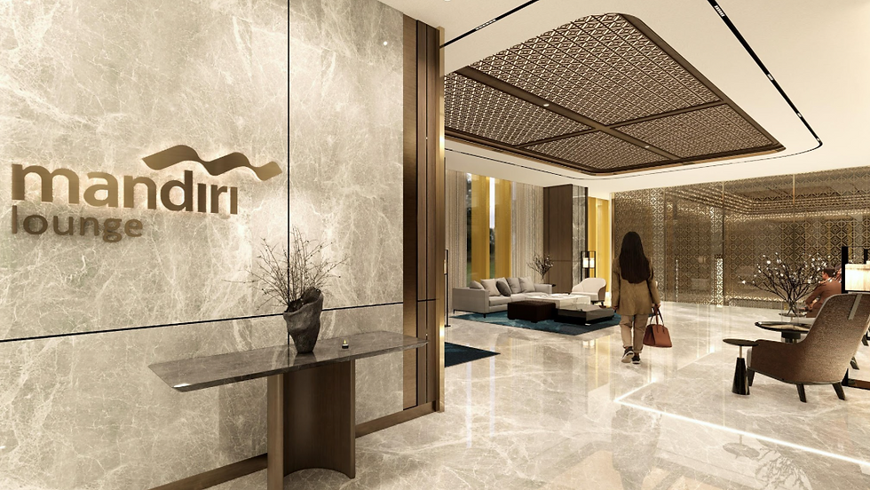 Entrance Mandiri Lounge — dinding marmer abu-abu dengan logo emas brass dan plafon geometrik Nusantara