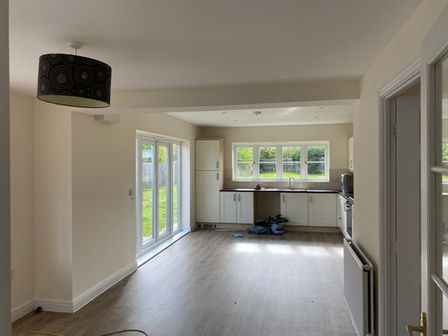 Freshly painted kitchen and dining area by Adam's Painting.