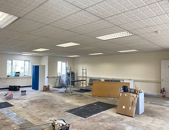 Interior painting and decorating in Newbury. Empty room with equipment and tools.