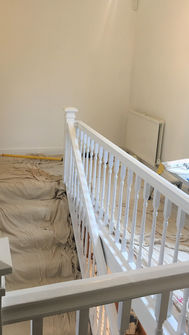 Adam's Painting freshly painted white staircase banister