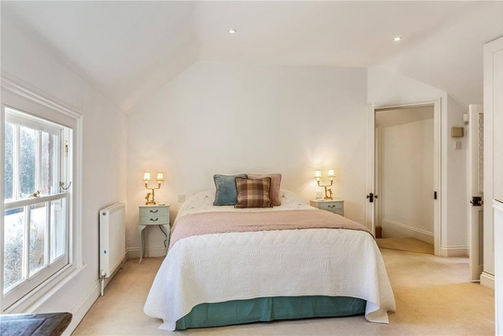 Bedroom with white walls finished by Adam's Painting
