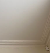 A team member working on smoke stain removal, restoring the walls of a property with meticulous care and professional techniq