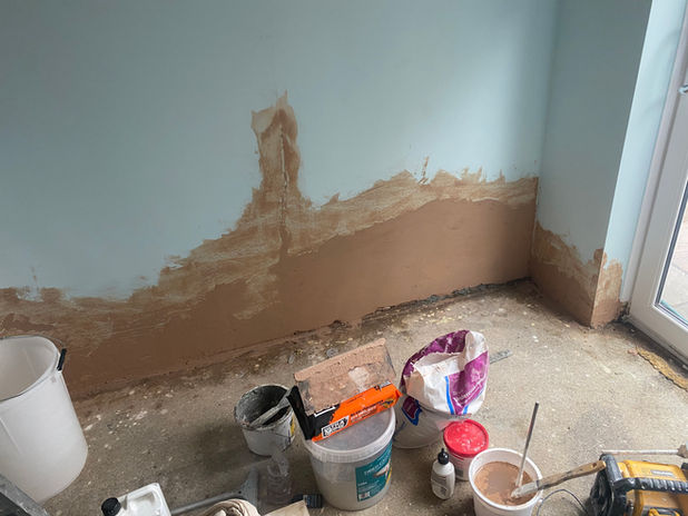 Water damage repairs Newbury showing replastered lower walls.