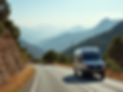 A sturdy van parked on a scenic, winding road in Corsica, with mountains in the background