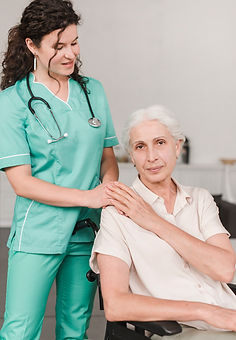 A female nurse accompanies female patients.