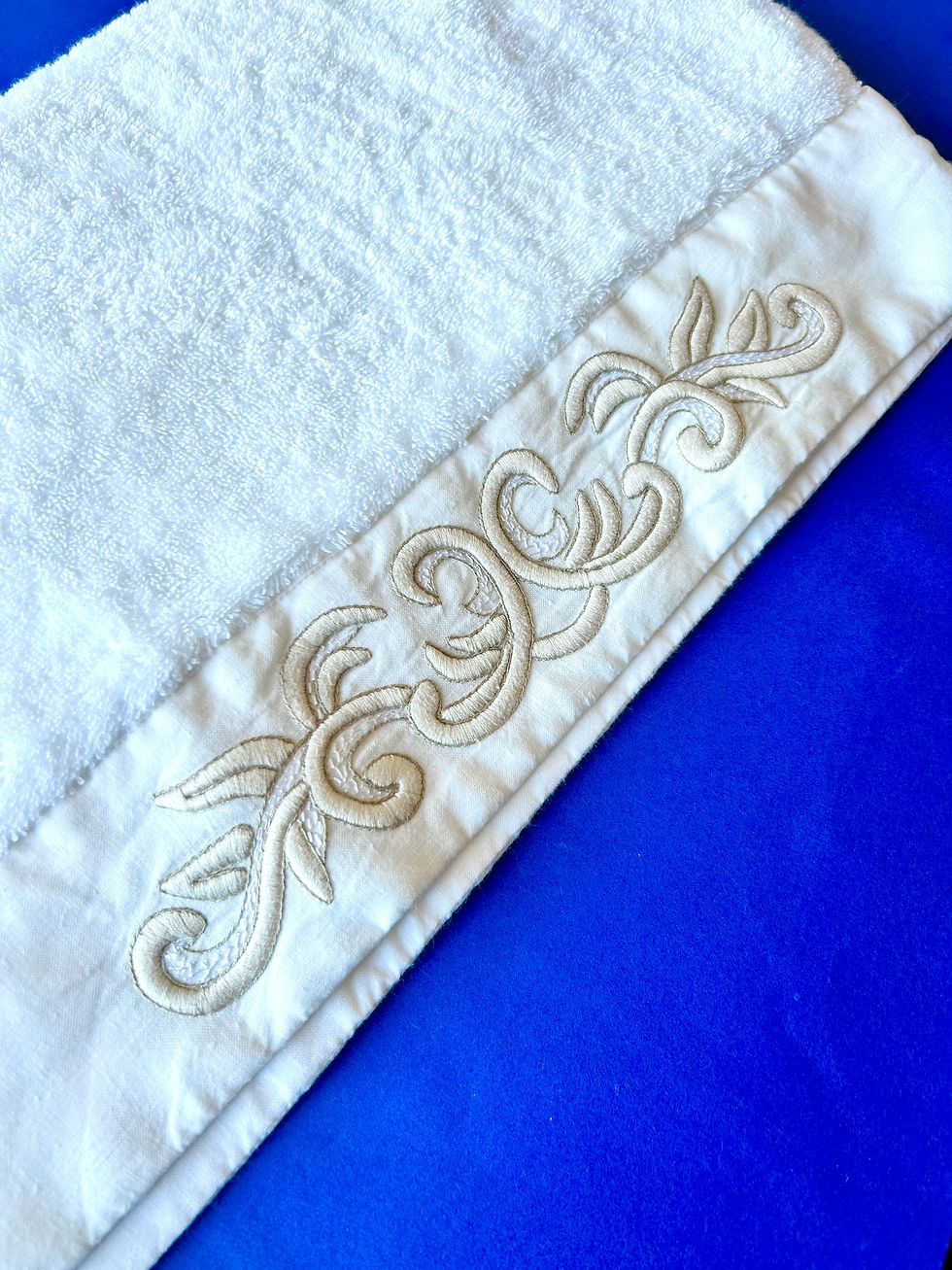 Embroidered linen appliqué