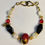 Thumbnail: Bongle - Gold  Red Glass Bead White Black Glass Beads