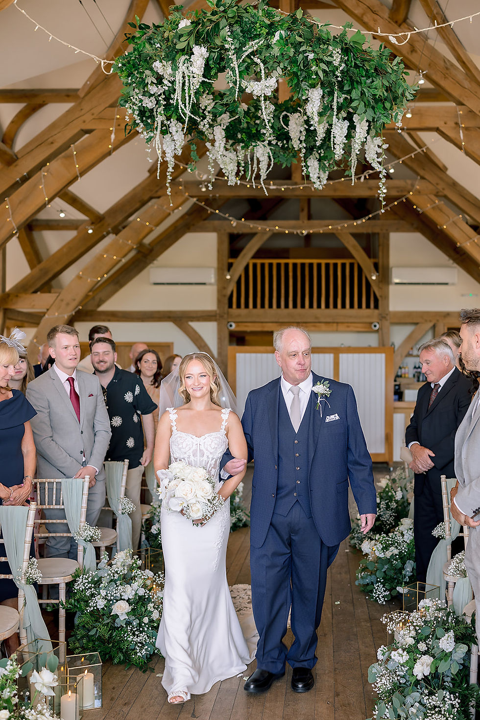 A father walking his daughter down the aisle.