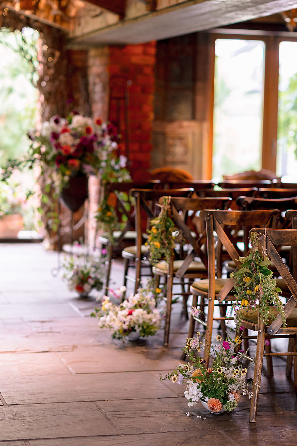 flowers on chairs in the chapel at Newton Hall