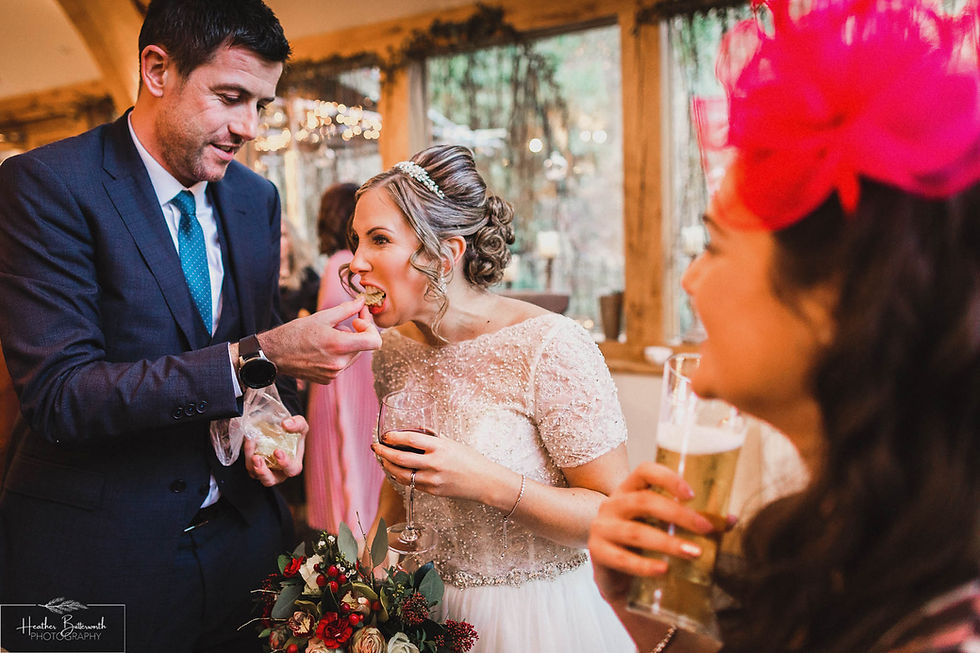 hungry bride being fed crisps after the wedding ceremony at the woodman inn Yorkshire leeds photographer