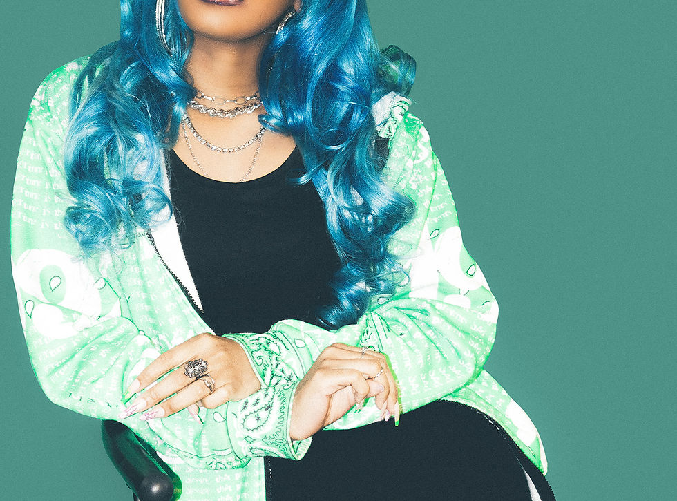 Woman with blue hair and green jacket