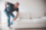 Man Back Pain Lifting Couch.jpg