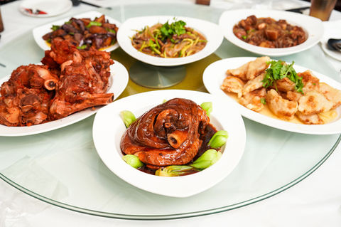 Various Chinese dishes arranged on a round table, The Taste of North China 老东北