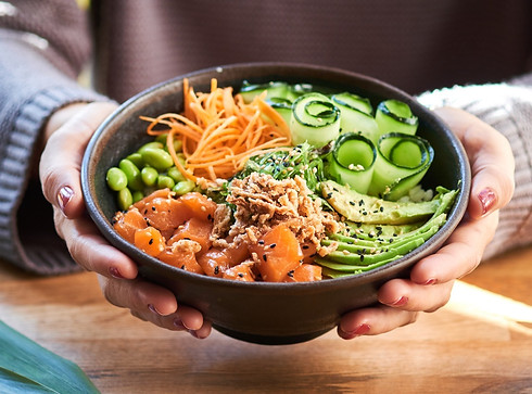Person holding delicious poke bowl