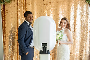 A couple at a Photo Booth