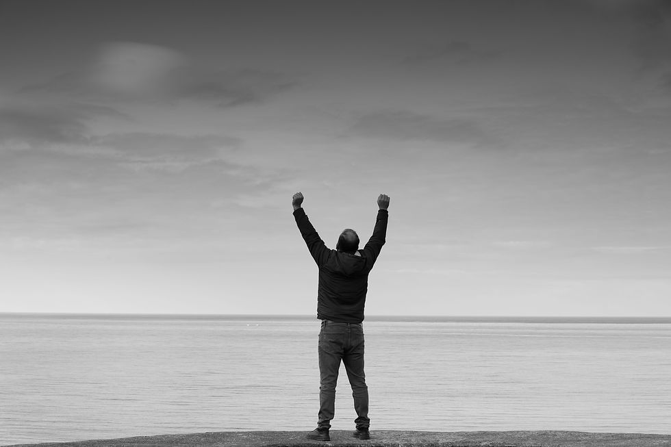 man celebrating in triumph