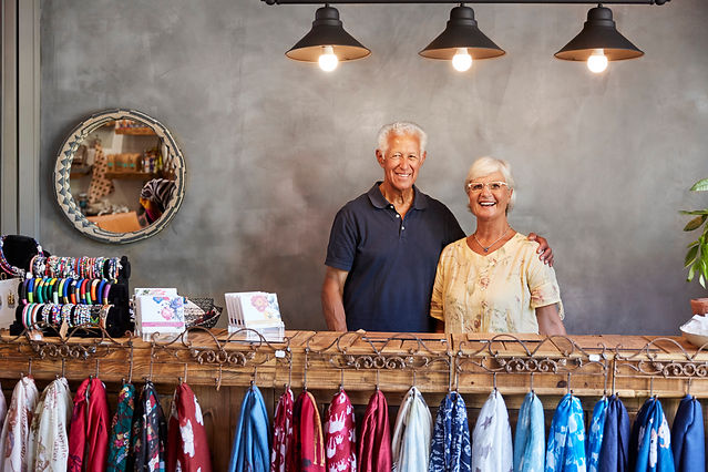 A couple behind the display ont their small business in Florida