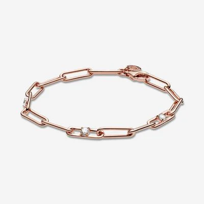 Rose gold bracelet with rectangle links and small, sparkling jewel accents.