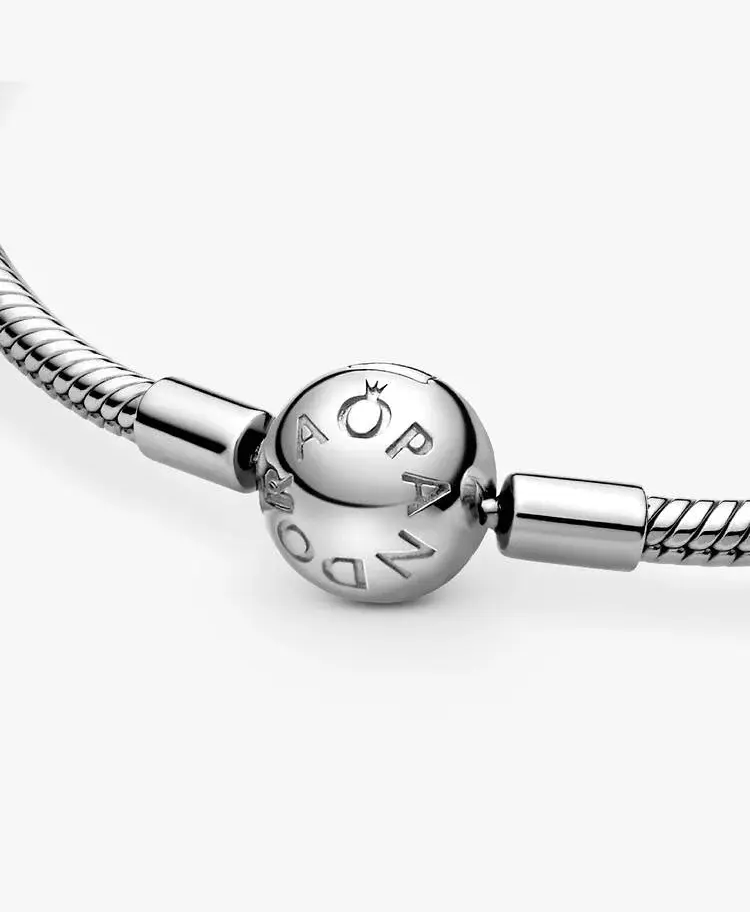 Silver Pandora bracelet with a round clasp and the brand name visible.
