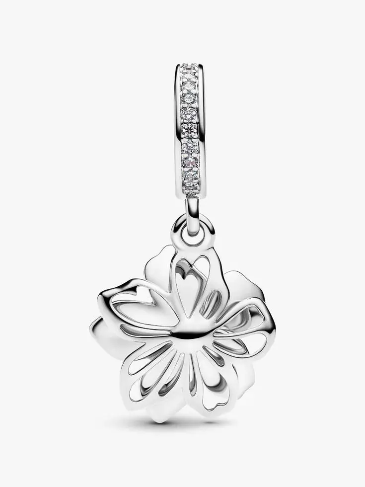 Silver floral dangle charm with intricate petal design, Jewels by the Sea.