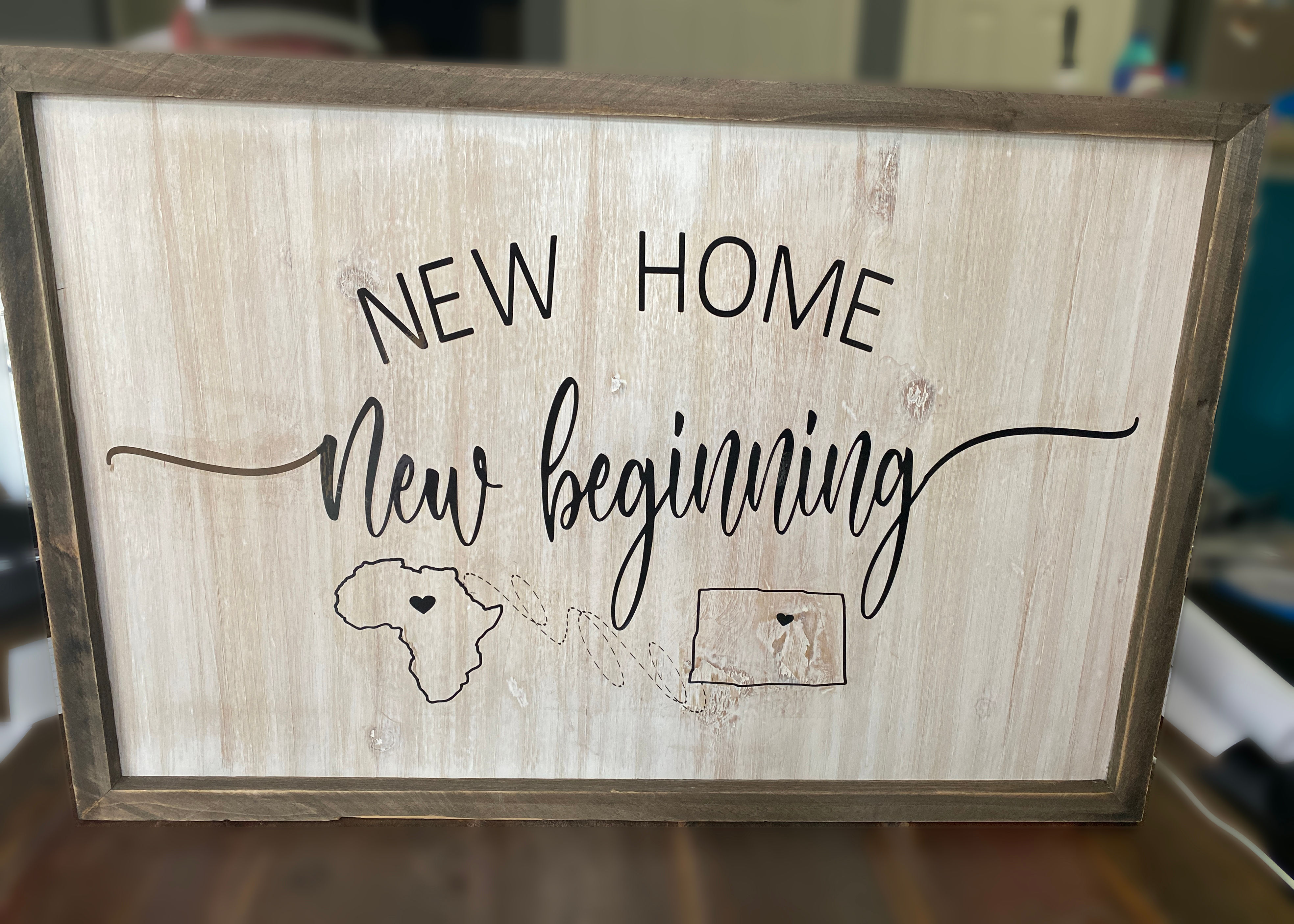 "New Home New Beginning" sign