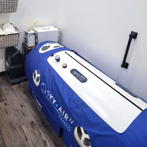 Blue hyperbaric chamber OXY-AIR 32 OXYGEN HYPERBARIC CHAMBER in clinic room.