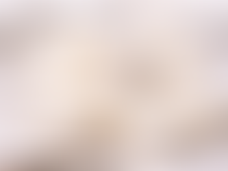 Freshly cut homemade marshmallows dusted with arrowroot powder, arranged on parchment paper in soft square shapes, highlighting their fluffy texture and clean ingredients.