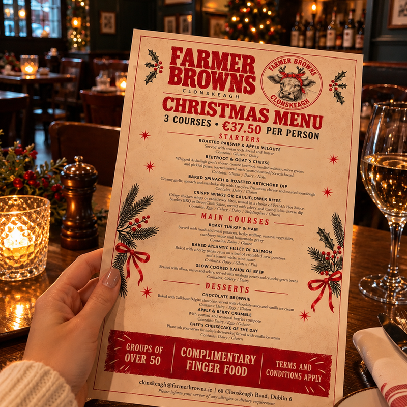 Elegant vegan cocktail in a refined restaurant setting with warm ambient festive details