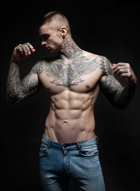 Artistic male portraiture of Maxim Volkov flexing his muscles in blue jeans by men’s portrait, fitness and artistic nudes photographer ADDD Photography