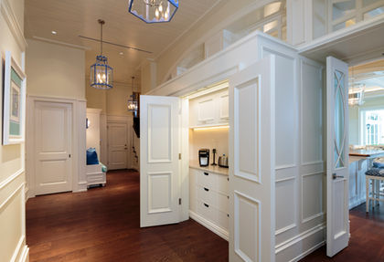 White butler pantry with hidden storage and traditional design, Naples Bay Colony.