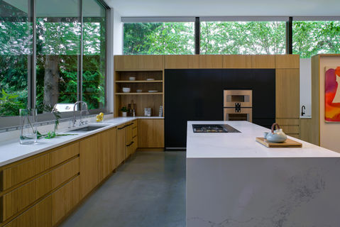 Alternate view of modern oak and dark painted kitchen, Seattle.