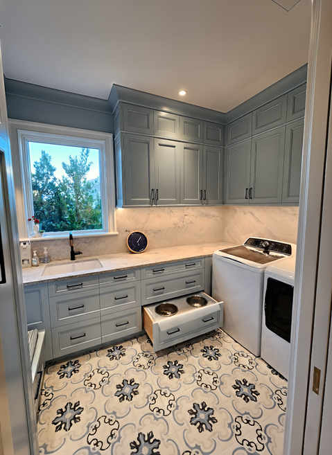 Close-up of blue painted custom laundry cabinetry, Naples.