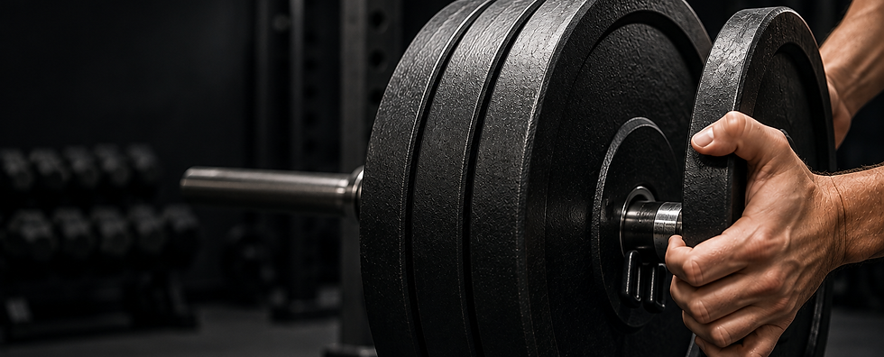 Hands loading weight plates for muscle building training guides.