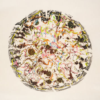 This encaustic monotype in the shape of a circle is brown and green and pink.