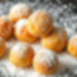 golden brown soft pastry perfect balls without coating on white powdery sugar.jpg