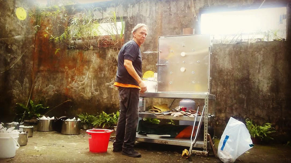 David at work in front of his kiln