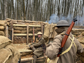 Armed British soldiers in a trench