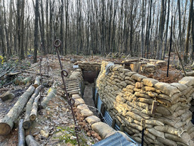 Image of ww1 trench surrounded by barbed wire