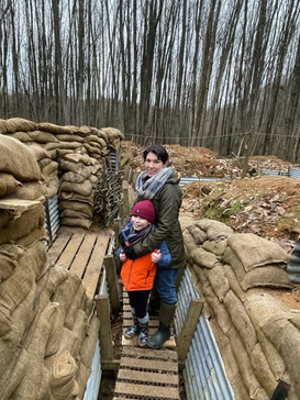 A mother and son visit our trench experience.