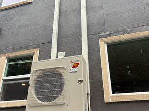 Copper & Cable Co. technician installing new air conditioner in Olympia WA home