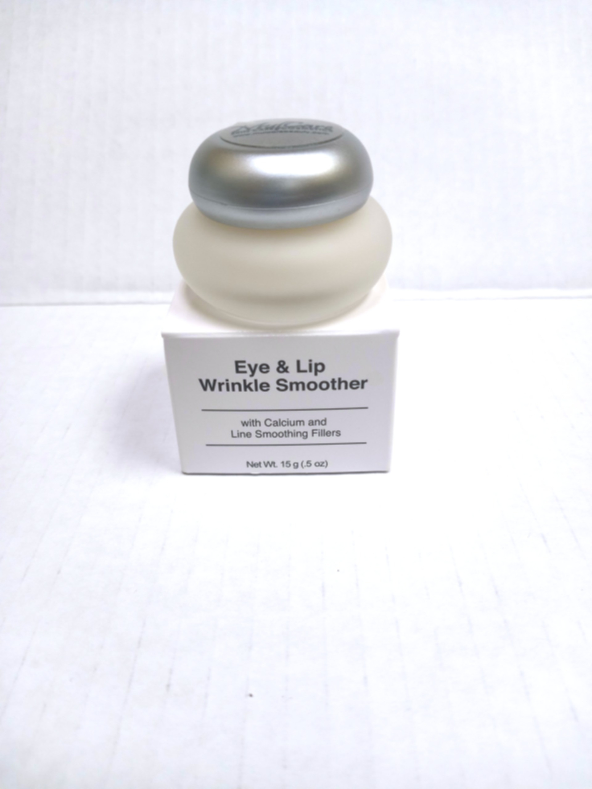 A compact jar of targeted wrinkle smoother, formulated for delicate eye and lip areas