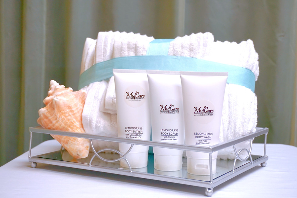 A trio of lemongrass-scented body care essentials: Body Wash, Butter, and Scrub, presented in matching elegant container