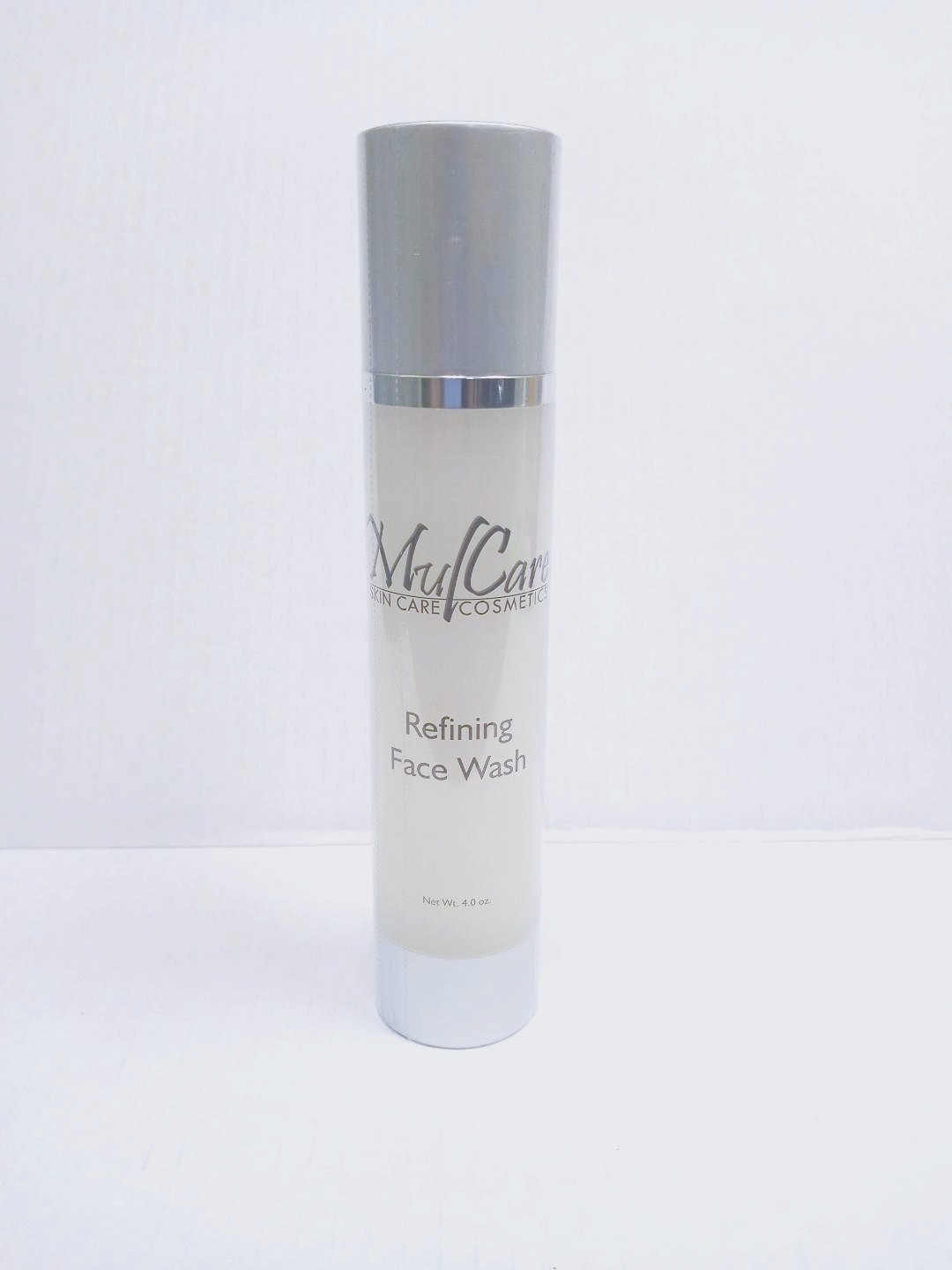A clear, lightweight face wash in a sleek pump bottle, designed for deep cleansing and refining the skin’s texture