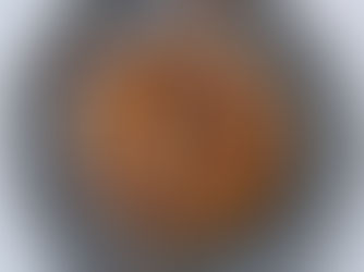 A stack of golden brown sweet potato pancakes with pecans