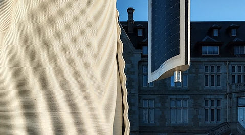 A 3D-printed, CO2-capturing skin for a solar-wind energy tower at Palacio de la Magdalena, blending organic design with ecological urbanism for local energy generation and carbon capture